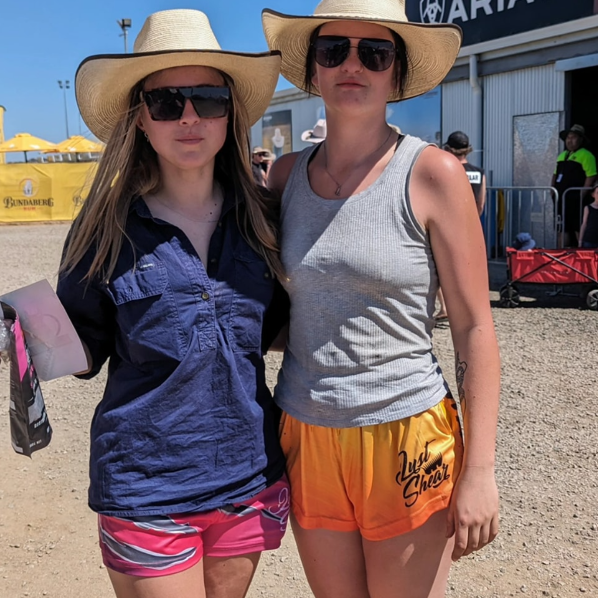 Girls wearing footy shorts at Deni Ute Muster